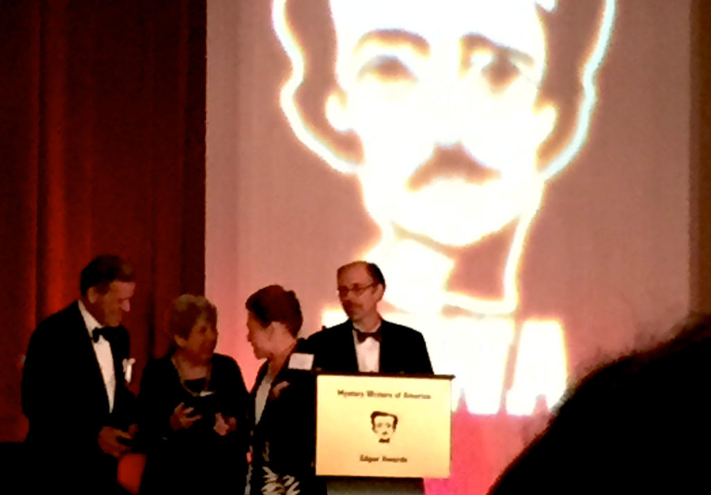 Caroline & Charles Todd receiving the Mary Higgins Clark Award from Mary Higgins Clark and MWA president Jeffery Deavers