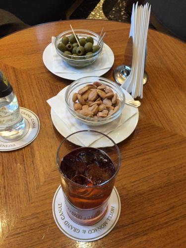 6 Cynar spritzer with orange, Marcona almonds, and Piccholine olives